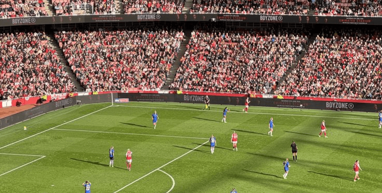 Fans meeting up at a stadium fan zone